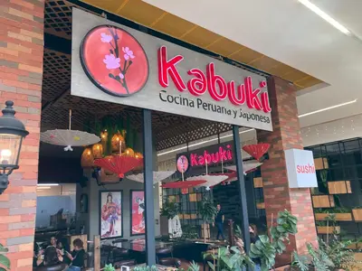 a kolkata restaurant with a sign on the front of it at Home away from home - By Adri in Envigado