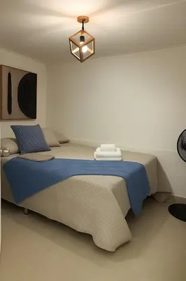 a bedroom with a large bed in a room at Cozy 2BR in Prime El Poblado in Medellín