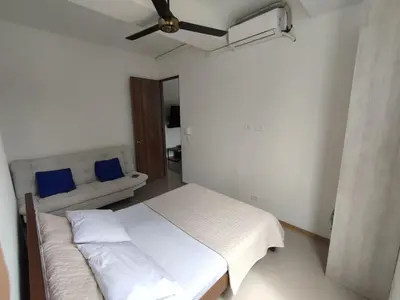 a bedroom with a bed and a ceiling fan at San Jeronimo - Apartamento - Hospedaje in San Jerónimo