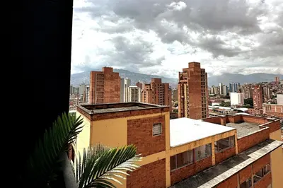a view of a city from the roof of a building at Central Medellin Modern Loft - Balcony and Transit in Medellín