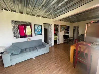 a living room with a couch and a table at CASA FINCA San Rque Antioquia in San Roque