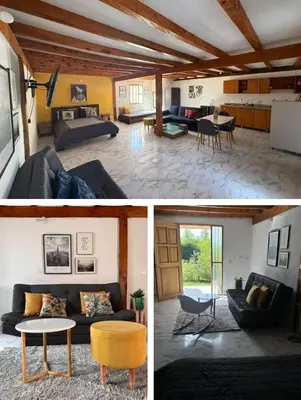 a living room with a couch and a table at Casa Madeira in Rionegro