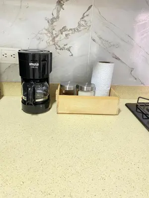 a coffee maker sitting on a counter next to a box at Casa moderna en el centro Carmen V WI-FI in Carmen de Viboral