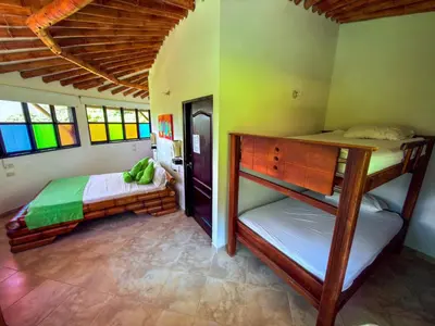 a bedroom with two bunk beds in a room at Solvae EcoHotel in San Jerónimo