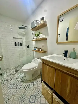 a bathroom with a toilet and a sink at Suitable unique design with natural light Envigado in Envigado
