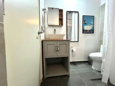 a bathroom with a sink and a toilet at Suitable unique design with natural light Envigado in Envigado