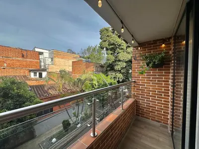 a balcony with a view of a brick building at Suitable unique design with natural light Envigado in Envigado