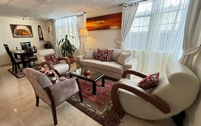 a living room with a couch and chairs and a table at Casa Boutique Familia Hurtado in Manizales