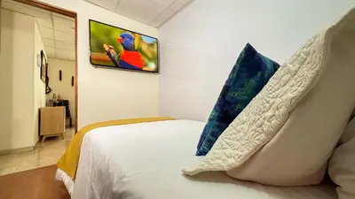 a bedroom with a bed with two pillows on it at Casa Boutique Familia Hurtado in Manizales