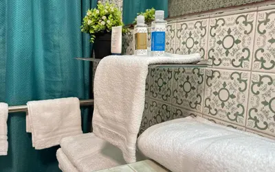 a bathroom with a towel rack and a toilet at Casa Boutique Familia Hurtado in Manizales