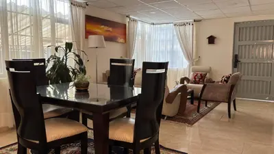 a dining room with a table and chairs at Casa Boutique Familia Hurtado in Manizales