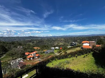 a group of houses on top of a hill at Cabaña El Sueño de OPAD in Guarne