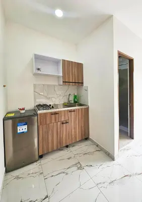 a kitchen with a sink and a stove at Casa Eterna Campo Valdes in Medellín