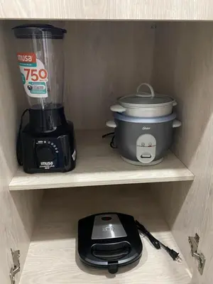 a coffee maker and a blender on a shelf at Class 48 Exclusivo y elegante apartamento in Sabaneta