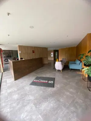 a living room with a couch and a table at Class 48 Exclusivo y elegante apartamento in Sabaneta