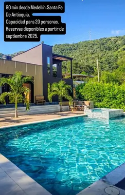 a swimming pool in front of a building at La Fonte di Luce in Santa Fe de Antioquia