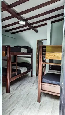 two bunk beds in a room with a ceiling at La Fonte di Luce in Santa Fe de Antioquia