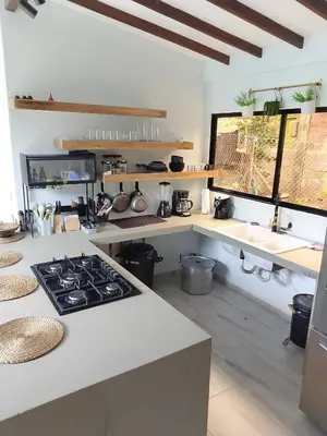 a kitchen with a stove and a counter top at La Fonte di Luce in Santa Fe de Antioquia