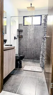 a bathroom with a shower and a sink at La Fonte di Luce in Santa Fe de Antioquia