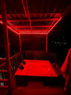 a red room with a bed with a red light at Finca Crucytania in Titiribí