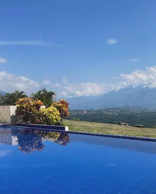 a swimming pool with a view of the mountains at Finca El Paraíso in Santa Fe de Antioquia