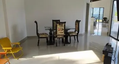 a dining room with a table and chairs at Finca El Paraíso in Santa Fe de Antioquia