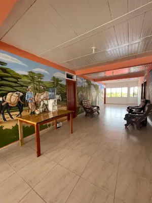 a large room with a painting on the wall at Hotel Marquez in Norcasia