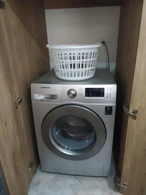 a washing machine with a basket on top of it at Acogedor Apartaestudio en Laureles in Medellín