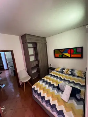 a bedroom with a bed and a painting on the wall at Apartamento Hayalón in Betania