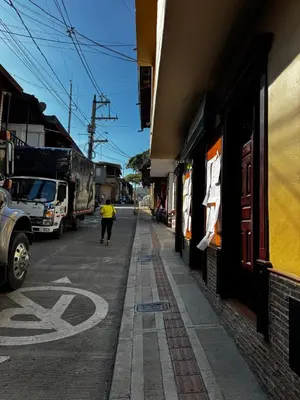 a person walking down a street next to a building at Apartamento Hayalón in Betania