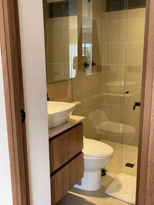 a bathroom with a toilet and a sink and a shower at Loft poblado con parqueadero in Medellín
