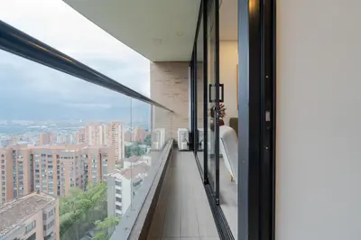 a balcony with a view of a city at CLASS Suites in Medellín