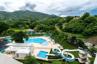 an aerial view of a pool at a resort at Relájate y Disfruta, Apartamento con Piscina, Tobogán y Vista Espectacular en Santa Fé de Antioquia in Santa Fe de Antioquia