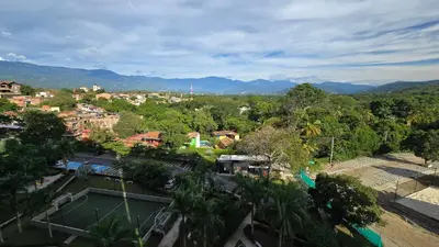an aerial view of a city with a tennis court at Relájate y Disfruta, Apartamento con Piscina, Tobogán y Vista Espectacular en Santa Fé de Antioquia in Santa Fe de Antioquia