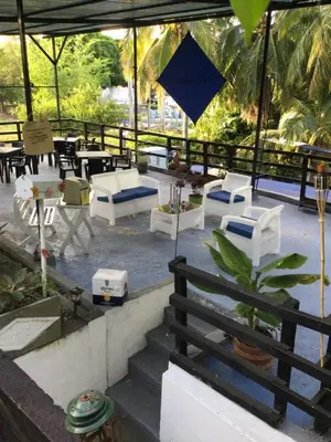 a patio with white furniture and tables and chairs at family home in Honda