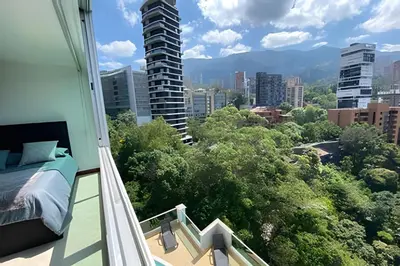 a balcony with a view of a city at Exclusive apto in Poblado in Medellín