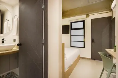 a bathroom with a shower and a sink at Hotel Attic 33 in Medellín