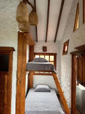 a couple of bunk beds in a room at Glamping Montesereno in El Peñol