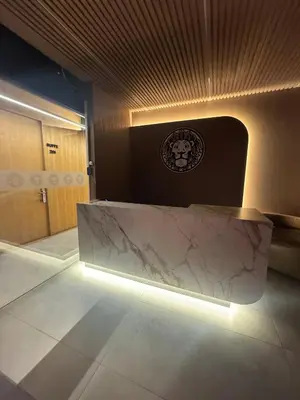 a lobby with a marble table with lights on it at Hotel Casa Leon Rooftop in Rionegro