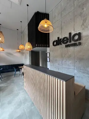 a lobby of an al salsa hotel with pendant lights at Akela30 Hotel in Medellín