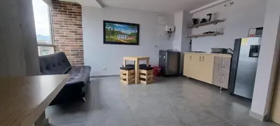 a kitchen with a refrigerator and a table and chairs at Great Laureles views, Cold AC and best price in Medellín
