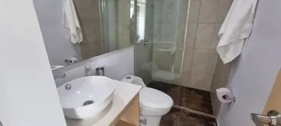 a bathroom with a sink and a toilet and a shower at Great Laureles views, Cold AC and best price in Medellín