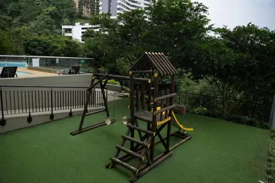 a playground on a balcony with green grass at Luxurious apartment in Las Palmas in Medellín