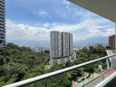 a view of a tall building from a balcony at Luxurious apartment in Las Palmas in Medellín