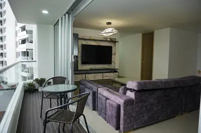 a living room with a couch and a table at Luxurious apartment in Las Palmas in Medellín