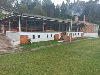 a house with a porch and a patio at Las Jodelinas in Guarne