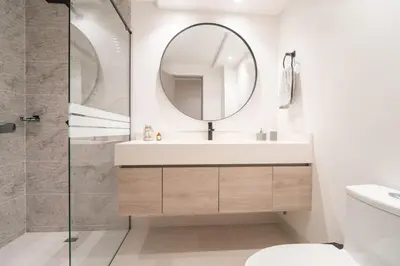 a bathroom with a sink and a mirror at Lux Lleras l Daily Cleaning l AC l Visitrs Allowed in Medellín