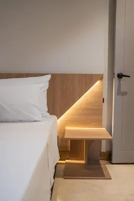 a bedroom with a bed and a stairway at Lux Lleras l Daily Cleaning l AC l Visitrs Allowed in Medellín