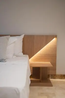 a bedroom with a bed and a wooden table at Lux Lleras l Daily Cleaning l AC l Visitrs Allowed in Medellín