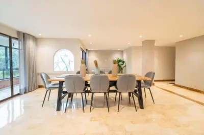 a dining room with a table and chairs at Lux Lleras l Daily Cleaning l AC l Visitrs Allowed in Medellín